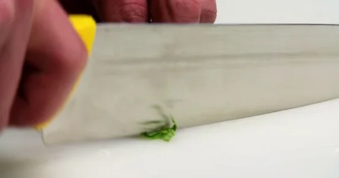 Chef cutting knife green herbs onion spinach 4k сlose up video. Food preparing Stock Footage 70005140