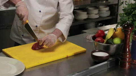 Chef cutting lamb ribs to grill it, medium shot Stock Footage 66076431