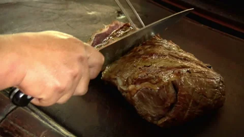 Chef cutting large piece of meat Stock Footage 100090070