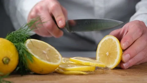 Chef cutting lemon Stock Footage 223211569