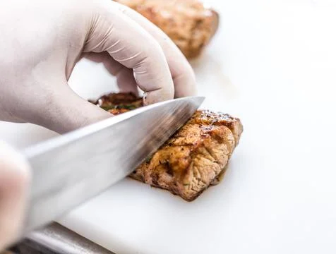Chef cutting meat Stock Photos