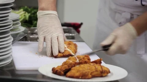 Chef cutting the meat into pieces Stock-Footage 80894678