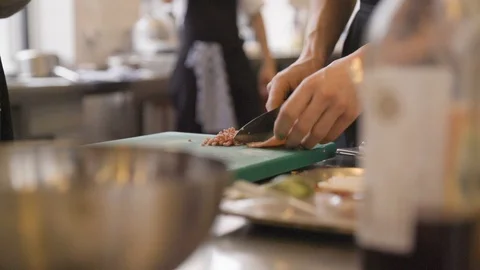 Chef Cutting Meat Slow Motion Stock Footage 127036495