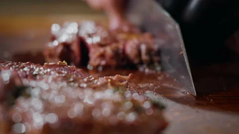 Chef Cutting a Medium Cooked Beef Looks Very Tasty Close Up Slow Motion Video Stock Footage 162238325