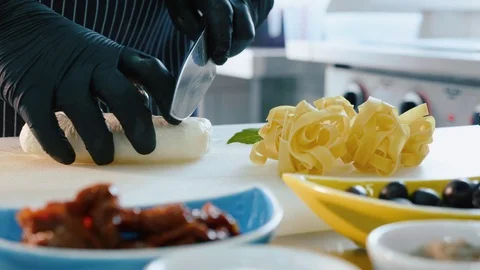 Chef cutting mozzarella cheese at restaurant kitchen. Stock Footage 91370034