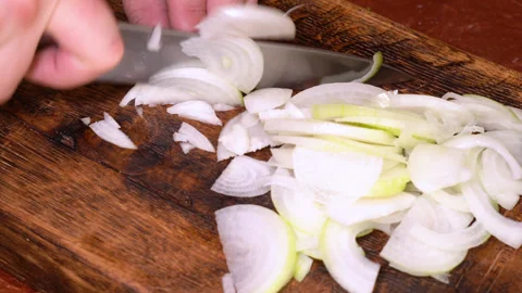 Chef cutting the onion at cutting board. High quality 4k footage Stock Footage 249960223