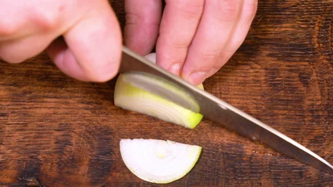 Chef cutting the onion at cutting board. High quality 4k footage Stock Footage 249962629