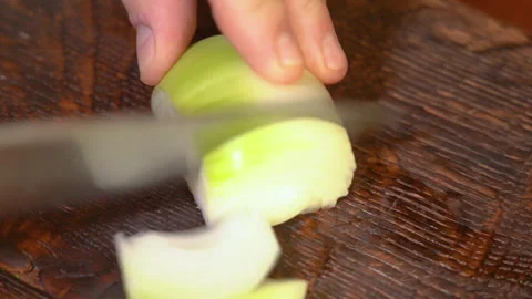 Chef cutting the onion at cutting board. Stock Footage 250441537