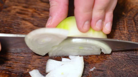Chef cutting the onion at cutting board. Stock Footage 254271706