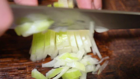 Chef cutting the onion at cutting board. Stock Footage 254271902