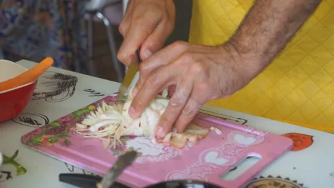 Chef cutting up an onion with a knife, close up Stock Footage 95646396