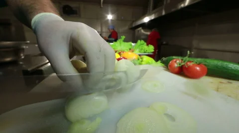 Chef cutting up an onion with a knife  Stock Footage 68014524