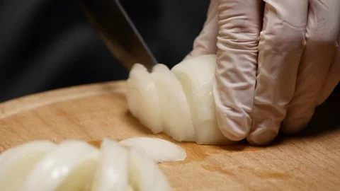 Chef cutting up an onion with a knife Stock Footage 85217944