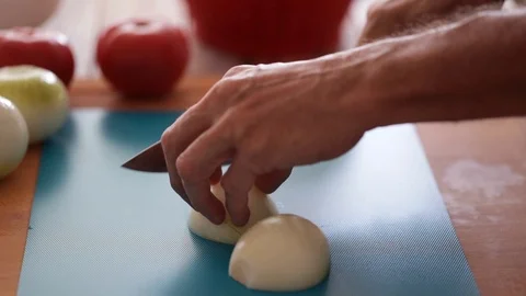 Chef cutting onion, steadicam close-up Stock Footage 91275939
