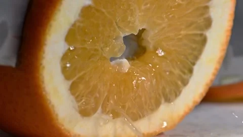 Chef Cutting Orange with Knife on Cutting Board Stock Footage 328348030
