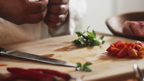Chef cutting parsley on a cutting board Stock Footage 274671985