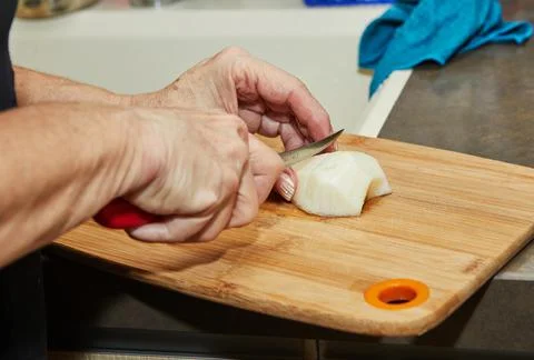 Chef is cutting pear to make pie Stock Photos