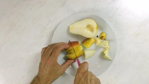 Chef cutting pears Stock Footage 100232225