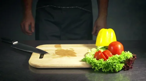 Chef cutting pepper on the board Stock Footage 65337272