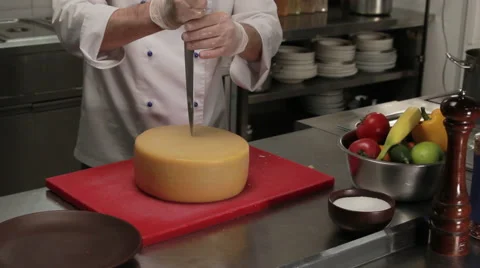 Chef cutting a piece of cheese, medium shot 스톡 동영상 66074989