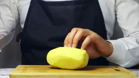 Chef Cutting Potato To Half Stock-Footage 182551687
