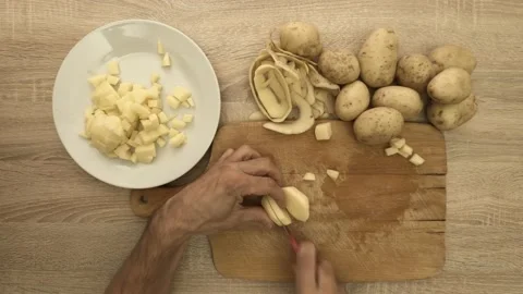 Chef cutting potato with knife Stock Footage 121977698