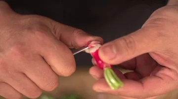 Chef cutting a Radish Stock Footage 85785243