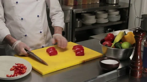 Chef cutting red bell pepper finely, medium shot Vídeos de archivo 66069991