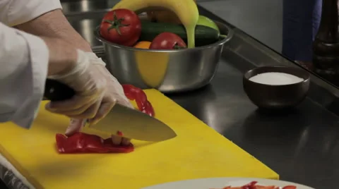 Chef cutting red bell pepper finely Stock Footage 66073453