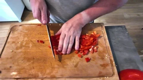 Chef cutting red bell pepper and removing seeds Stock-Footage 342985700