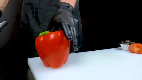 The chef is cutting red bell peppers. Stock Footage 132993932
