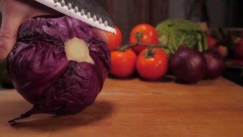 Chef cutting red cabbage with knife slow motion 4k Stock Footage 149671513