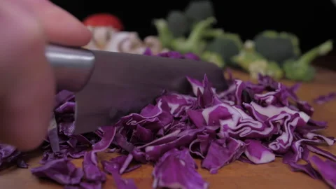 Chef cutting red cabbage with knife Stock Footage 149707841