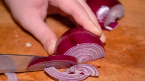 Chef cutting the red onion at cutting board Stock Footage 248530797