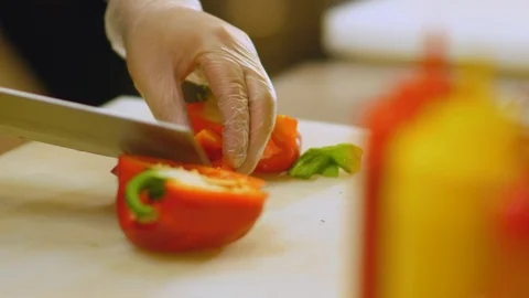 Chef is cutting red paprika Stock Footage 104335489