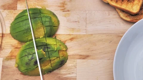 Chef Cutting Ripe Avocado Into Small. top view Video stock 221275493