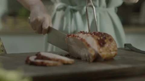 Chef Cutting Roasted Spiced Meat on Kitchen Board Stock Footage 159329050