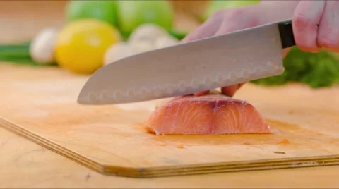 Chef cutting salmon fish on fillets with knife Video stock 57724149