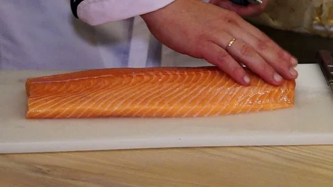 Chef cutting the salmon Stock Footage 97183752