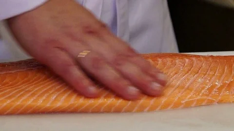 Chef cutting the salmon Video stock 97650614