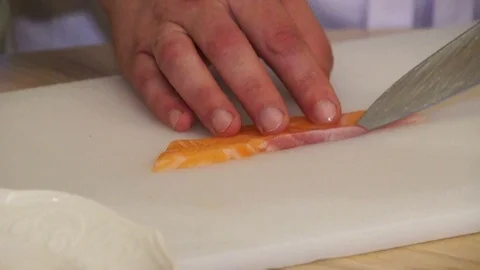 Chef cutting the salmon Stock Footage 98208452