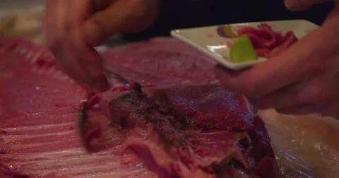 Chef cutting scraping bluefin tuna fish spoon 4k video sushi restaurant kitchen Stock Footage 67487658