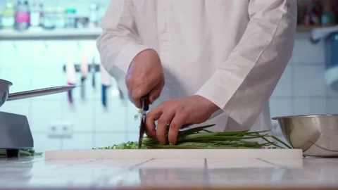 The chef cutting spring onion. Stock Footage 154457553