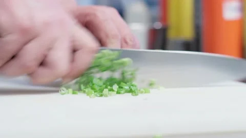 The chef cutting spring onion. Stock Footage 154490613