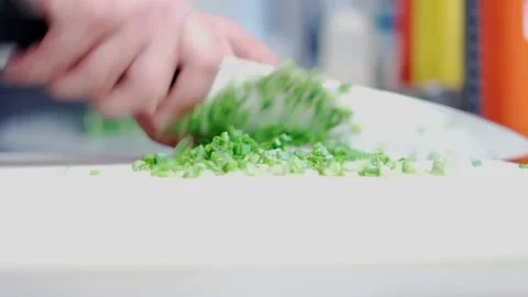 The chef cutting spring onion. Stock Footage 154490679