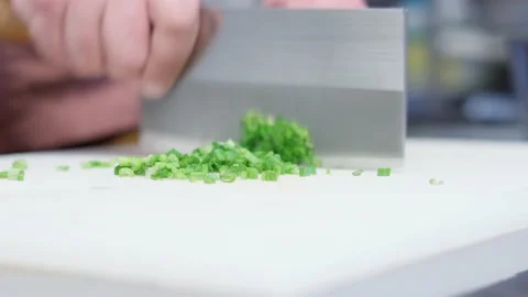The chef cutting spring onion using sharp knife. Stock Footage 152408053
