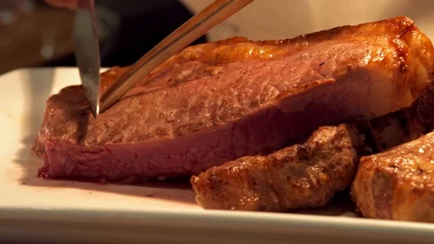 Chef cutting steak close up medium raw Stock Footage 124396621