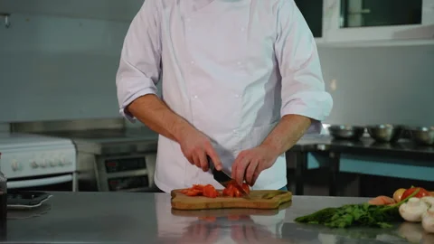 Chef Cutting Tomatoes for Cooking Prep in Restaurant Kitchen Stock Footage 299661428
