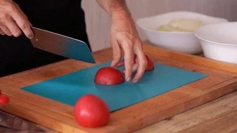 Chef cutting tomatoes, steadicam close-up Stock Footage 91275796