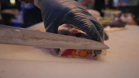 Chef cutting tuna mango rice sheet sushi roll – 4K video Stock Footage 315565037